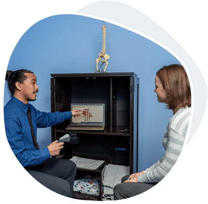 Chiropractic Evaluation in exam room with patient